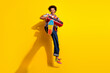 © deagreez - Full size photo of nice funky young man jump boombox wear shirt isolated on bright yellow color background