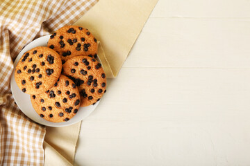 Sticker - Plate of tasty cookies with chocolate chips on light wooden background