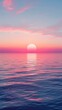© Phiranchaya Thatham - A vibrant sunset casts a warm glow over a calm ocean. Pink and orange hues illuminate the sky and water, creating a serene and beautiful scene.
