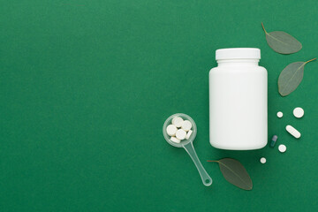 Sticker - Bottle with pills and green leaves on color background, top view