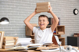 Fototapeta Pokój dzieciecy - Teenage boy with books at table in library