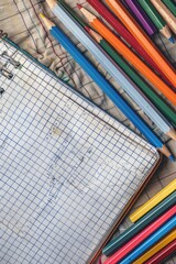 Poster - A collection of colorful pencils and a notebook ready for creative use