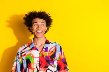 Wall Mural - Photo of nice young man look empty space wear shirt isolated on bright yellow color background