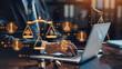 © Chatchanan - Lawyer using a laptop to work with legal services icons on a virtual screen, offering online legal advice on business legislation and justice