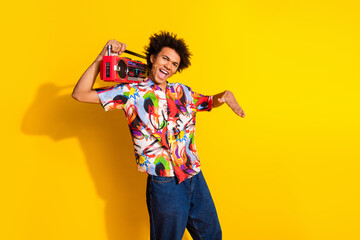 Sticker - Photo of nice funky young man dance boombox wear shirt isolated on bright yellow color background