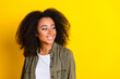 © deagreez - Photo of adorable mixed race girl with perming coiffure wear khaki shirt look at sale empty space isolated on yellow color background