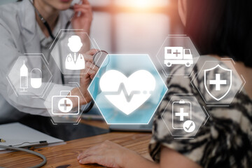 Healthcare professional consulting a patient with futuristic medicare concept icons and digital interface, symbolizing modern medical services and technology.