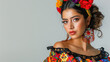 © Chatchanan - Stylish Mexican woman in traditional attire, posing on a white background.