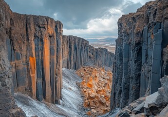 Wall Mural - A panoramic view of a volcanic crater with steep, rugged walls and unique geological formations at the bottom