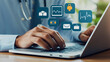 © Studios - Secure Online Healthcare Services: Doctor Using Laptop with Medical Icons