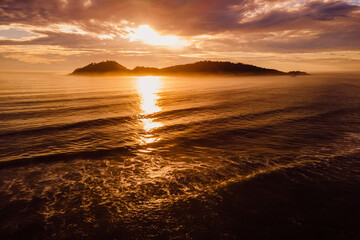 Canvas Print - Sunrise and silhouette of Campeche island in Florianopolis, Brazil