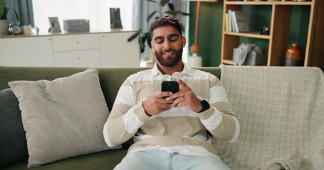 Poster - arab man, phone and relax on sofa in home for social media, communication and mobile app with smile.