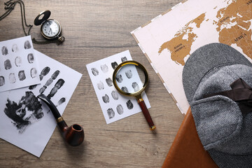 Wall Mural - Magnifying glass with fingerprints, map and hat