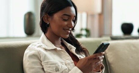 Poster - Indian woman, smartphone and scroll on sofa at home, reading and typing on mobile application in lounge. Female person, connection and phone for internet browsing, info and comment on blog in couch