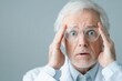 © 1000lnw - An elderly man looks surprised and concerned, showcasing emotions of disbelief and confusion in a clinical setting.