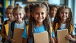 © Five Million Stocks - Portrait of cheerful smiling diverse schoolchildren standing posing in classroom holding notebooks and backpacks looking at camera happy after school reopen. Diversity. Back to school concept