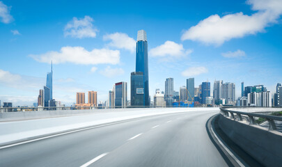 Poster - Highway overpass motion blur with modern city skyline in Kuala Lumpur