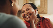 © AzeemudDeen/peopleimages.com - Mature, mom and daughter with hand on face for love, gratitude and affection or emotional connection. Black family, woman and happy mother with embrace in home, bonding and together with support.