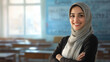© Julia Zarubina - young smiling muslim teacher against the background of classroom, September 1, back to school, education, knowledge, people, person, portrait, professional, professor, work, room, chalk board, woman