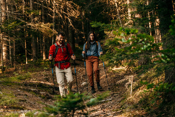 A couple walking through nature. Trekking, camping and wild life concept. Family getaway