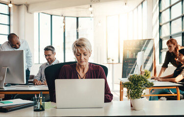 Poster - Mature woman, typing and laptop in office for creative journalism, research and coworking of copywriting project. Female person, digital and reading feedback, editing article and publishing agency