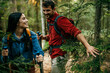© La Famiglia - Couple hike throught the forest together. Man cleaning a path for a woman to pass