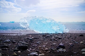 Wall Mural - Diamond Beach in Iceland with blue icebergs melting on black san