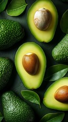 Wall Mural - Halved and whole avocados with green leaves