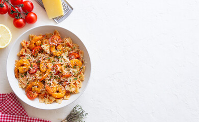 Wall Mural - Farfalle pasta with shrimps, tomatoes and cheese. Healthy eating. Italian food.