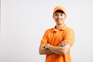 Portrait professional attractive delivery happy Asian man standing he smile wearing orange t-shirt and cap uniform crossed arms looking to camera, studio shot isolated on white background