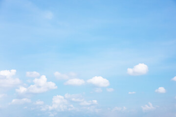 Wall Mural - blue sky background and white clouds soft focus, and copy space horizontal shape.