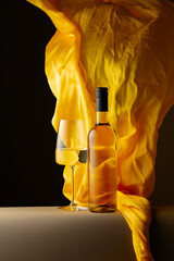 Wall Mural - White wine and flutters of yellow cloth.