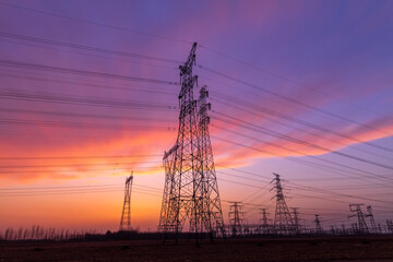 The pylons are in the evening, Substation in the evening, High voltage substation and beautiful sunset glow