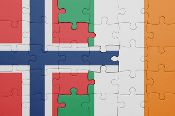 puzzle with the colourful national flag of ireland and flag of norway .