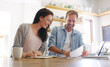 © peopleimages.com - Smile, couple and documents with love at house for financial planning, bank balance or debt payment. Happy, people and paperwork of budget savings, property insurance and credit score application