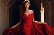 © juliars - Stunning fashion model in a flowing red gown against the backdrop of an ancient cloister