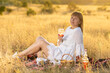 © Олег Мальшаков - Beautiful young girl with a glass of wine on a picnic