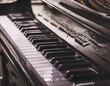 © SolaruS - Piano and music keys featuring elements like piano keys, sheet music, and musical notes representing music composition, performance, and creativity.
