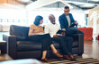 © peopleimages.com - Business people, relax and sofa with communication in office with ceo for monthly meeting, project updates or discussion. Boss, graphic designer team and conversation for creative brief and feedback.