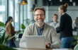 © RPL-Studio - sales manager working on the laptop, colleagues in the background