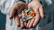 © Korea Saii - Pharmaceutical Industry Hand Holding Colorful Capsules in a Pharmacy Setting. This image captures the essence of the pharmaceutical industry with a hand holding capsules, symbolizing production.