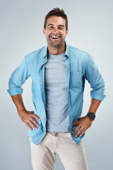 Poster - Portrait, laughing and happy man with casual fashion or outfit for confidence on white background. Model, positive designer or creative male person with studio, modern clothes or style to relax