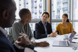 © ReeldealHD images - Successful businessman listening in an office board room meeting