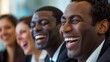 © Ali - Diverse business team laughing together during a meeting. Concept of teamwork, collaboration, success, and positive workplace culture.