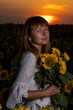 © Олег Мальшаков - Beautiful young girl in a white dress in sunflowers