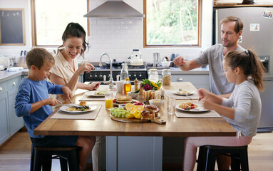 Poster - Happy family, kitchen table and eating breakfast for nutrition, food and meal as healthy diet in morning. Parents, children and house with excited, hungry and together on weekend for bonding in home