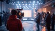 © MIKHAIL - Group of cameramen and technicians are working on a tv show set, surrounded by professional equipment. The stage is lit with warm lights