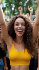 Joyful young woman celebrating at a lively outdoor event, showcasing happiness, excitement, and vibrant energy with raised arms.