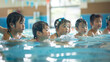 © bephoto - 屋内プールで水泳教室を受ける日本の幼児たち