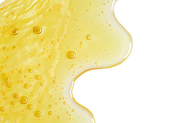 yellow texture of a drop of whey or olive oil on a white background. transparent sample of cosmetic 